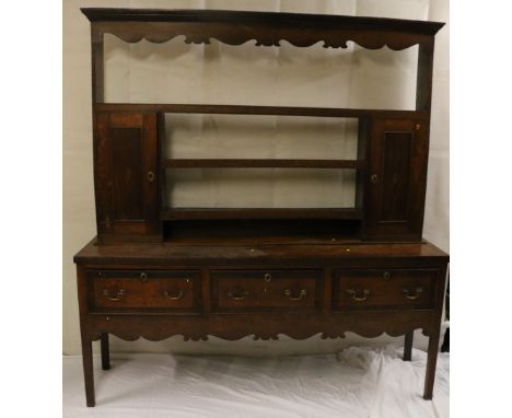 Antique oak and inlaid dresser with three frieze drawers and cupboard and shelf top above shaped skirt raised on square taper