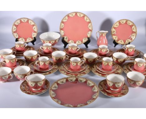 Royal Worcester W4551 part tea and coffee service, pink ground with floral and fern gilt on yellow border, comprising twelve 