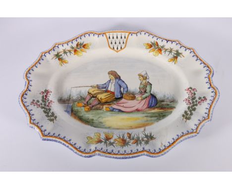 Henriot Quimper, France shaped oval serving platter or ashet depicting Breton figures fishing by a lake, 45cm x 32cm. 