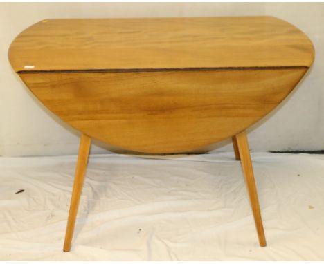 Ercol drop leaf oval dining table.