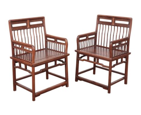 A PAIR OF CHINESE 'HUANGHUALI' COMB-BACK CHAIRSprobably early Qing, the fine spindle backs each flanked by conforming arm res