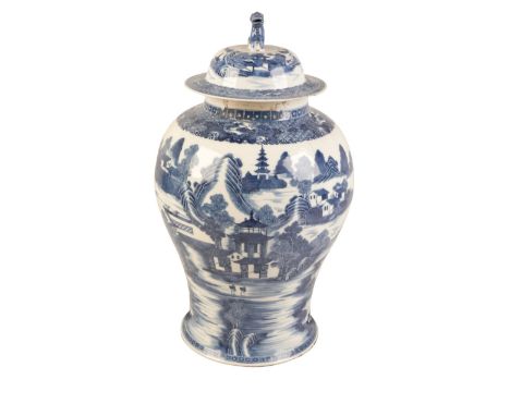 A CHINESE EXPORT BLUE AND WHITE VASE AND COVERQianlong, the baluster body decorated with a continuous landscape within panell