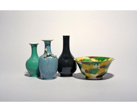 A Chinese Brinjal bowl, Kangxi (1662-1722), painted in 'egg and spinach' splashes of green, yellow and manganese, and three s