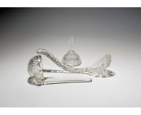 Two cut glass soup ladles and a wine funnel, 19th century, one ladle with a circular bowl and spout, the other with an oval b