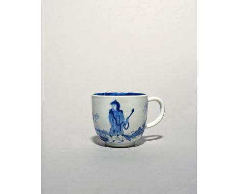 A Bow blue and white coffee cup, c.1760, the squat form painted with the Golfer and Caddy pattern, the interior rim with a th