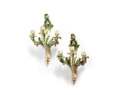 A pair of Minton three-light wall sconces (bras de cheminée) after Sèvres, 19th century, of rococo scrolled form with green a