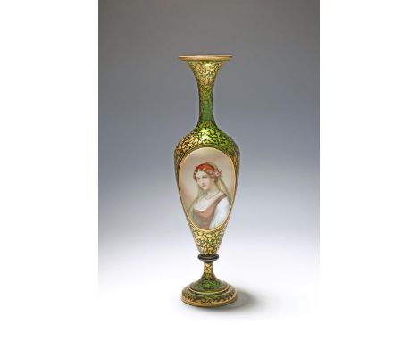 A tall Bohemian glass vase, 19th century, the slender green body applied with an opaque oval painted with the portrait of a y