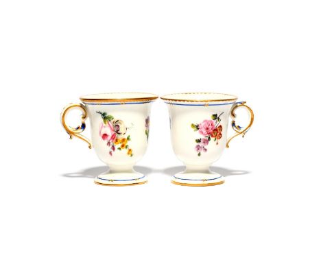 Two Sèvres ice cups (tasses à glace), c.1770,, painted with small flower sprays on a white ground within narrow blue borders 