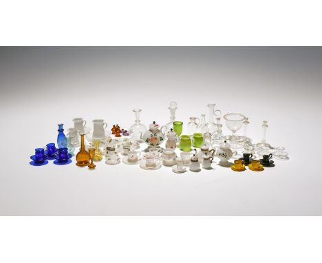 A collection of miniature or toy glassware, 19th/20th century, variously of clear, blue, green or amber glass, some opaque an