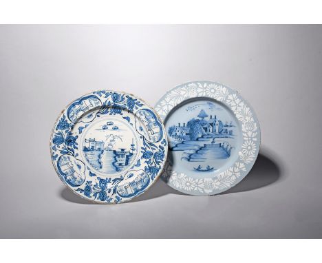 A large Bristol delftware charger, c.1760-70, painted in blue with figures in a boat and fishing beside a fence in an island 