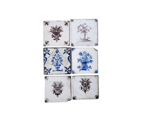 Five delftware tiles, c.1760-90, three probably Liverpool and painted in manganese with baskets of flowers over diaper panels