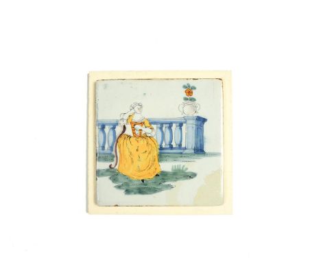 A Liverpool delftware tile, c.1755-75, well painted in polychrome enamels with a lady seated before a stone balustrade, weari