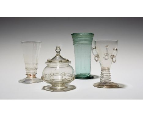 A German glass ring beaker (ringelbecher) and two other glasses, 18th/19th century, the beaker with three loose ring handles,