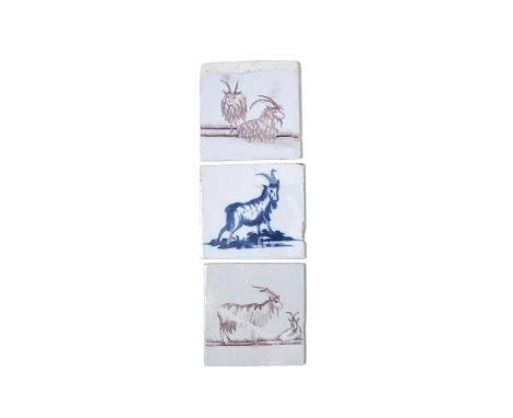 Three delftware tiles, c.1750-70, probably Liverpool, two painted in manganese with two goats lying or standing in a meadow, 