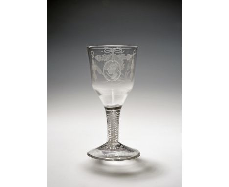 A large wine glass or goblet of possible Jacobite significance, c.1760, one side engraved with a carnation spray with two bud