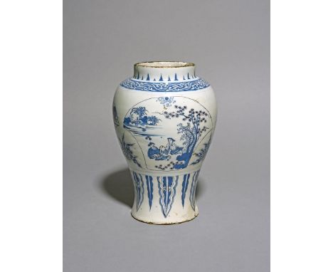 An unusual Delft vase, c.1660-80, the baluster body painted with three fan-shaped panels depicting Chinese figures beneath tr