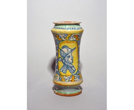 A Sicilian maiolica albarello, 17th/18th century, the slender waisted form painted with the profile portrait of a soldier wea