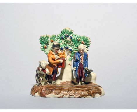 A Staffordshire figure group of a performing animal troupe, 1st half 19th century, with an organ grinder standing beside a da