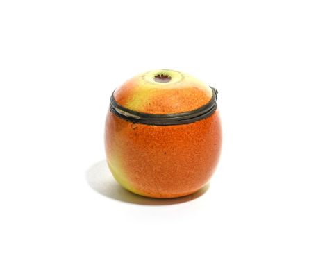 A South Staffordshire enamel fruit bonbonnière, c.1770-90, modelled as an apple with russet striations on a yellowy-green gro
