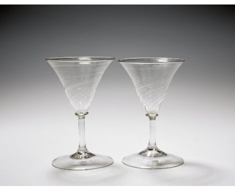 A pair of Venetian goblets, 19th century, the generous bowls with light spiral moulding, raised on slender plain stems beneat