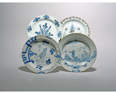 Four delftware plates, c.1740-70, one small plate of primitive shape painted in blue with a squirrel, another with simple sty