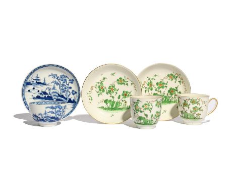 A pair of Worcester coffee cups and saucers, c.1780-90, painted with flowering branches issuing from rockwork in bright green
