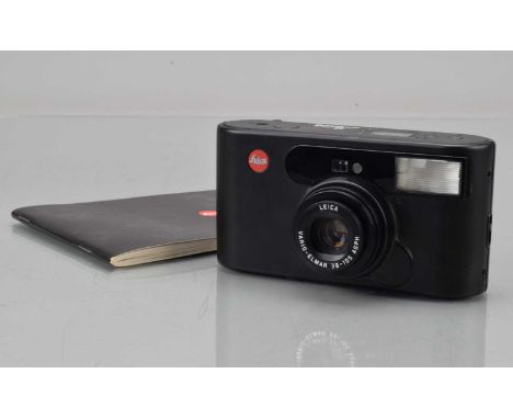 A Leica C1 Compact Camera, black, shutter working, flash working, self timer working, body F-G, slightly tacky & some marks t