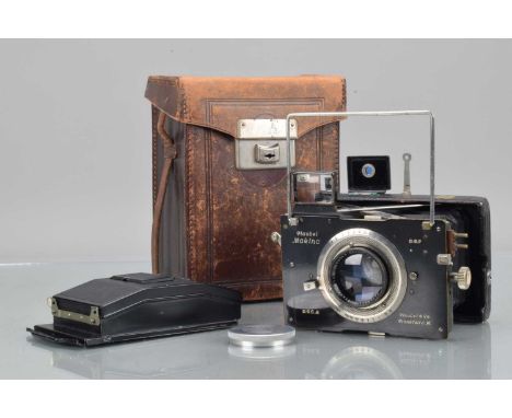 A Plaubel Makina II 4.5 x 6cm Folding Strut Camera,  black face, no rangefinder, flash sync added, shutter working, body G, s