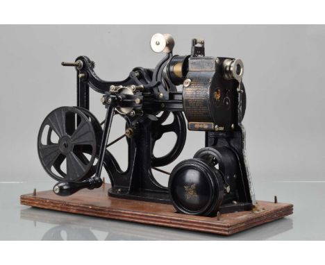 A Pathé Kok 28mm Cine Film Projector, serial no 2286, Patented No. 28714/1909, mechanism moves freely, dynamo powers lamp, so
