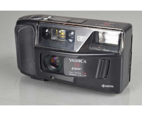 A Yashica T3 Super Compact Camera, shutter working, flash working, self timer working, body G, battery door not snapping shut