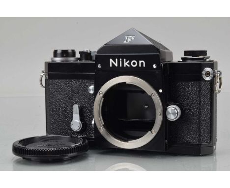 A Nikon F Eye Level Camera Body, black, serial no 6768905, shutter working, self timer working, body VG-E, tiny mark to front