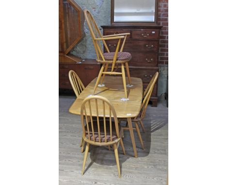 An Ercol blonde elm drop leaf table and four chairs. Condition - marks to table top otherwise fine.Table size:- 54" x 30" x 2