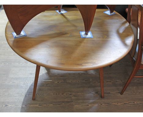 An Ercol blode elm drop leaf table.  Condition - good, general wear, minor marks and scratches etc.