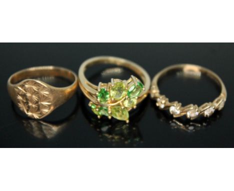 A group of three hallmarked 9ct gold rings, gross wt. 6.45g, sizes K, N &amp; O (left to right).  Condition - signet ring ben