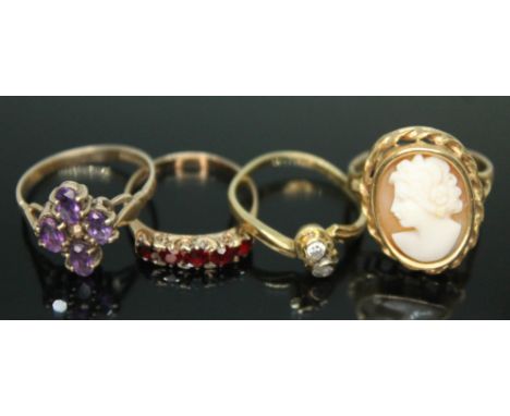 A group of four rings comprising two hallmarked 9ct gold, another marked '750' set with colourless stones and a cameo ring in