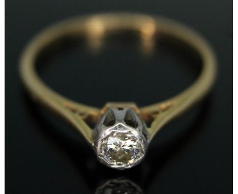 An early 20th century diamond solitaire ring, the modern round brilliant cut diamond weighing approx. 0.17 carats, band marke