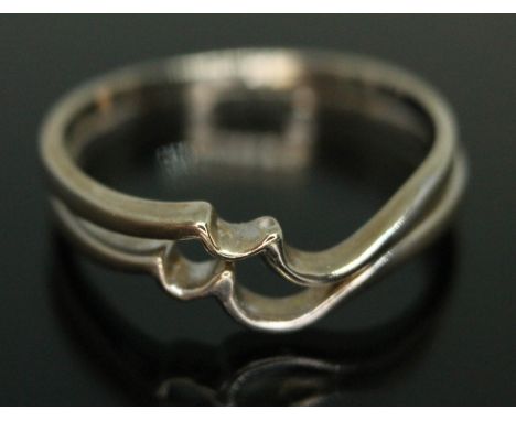 A combination ring of wavy form, both marked '18ct', gross weight 2.93g, size O.  Condition - good, minor wear only.