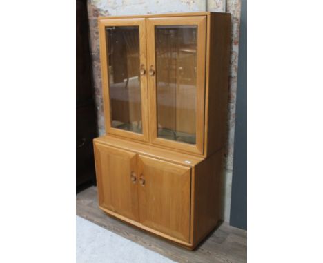 An Ercol blonde elm cabinet.  Condition - light scratches to top of bottom cabinet, otherwise ok, general wear.