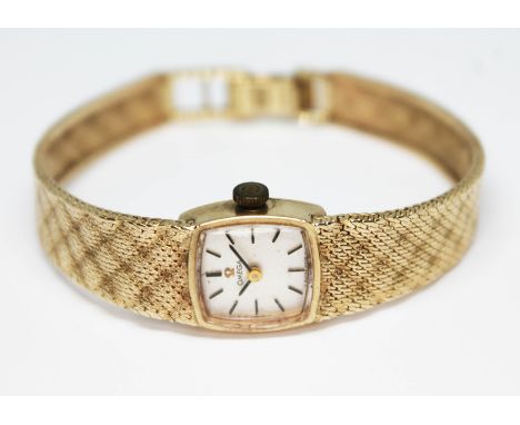 A 1972 hallmarked 9ct gold Omega ladies wristwatch having signed silvered dial with hour and hand batons in black, signed, re