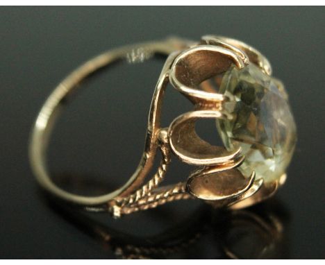 A hallmarked 9ct gold ring set with an oval cut citrine, gross wt. 4.60g, size N.  Condition - good, minor wear only.