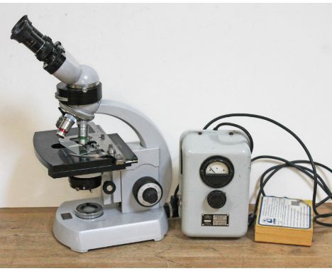 A Carl Zeiss electric microscope with additional slides and transformer.  