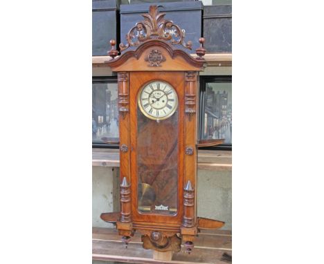 A large late 19th century double weight driven walnut Vienna wall clock by Gustav Becker, length 130cm.  