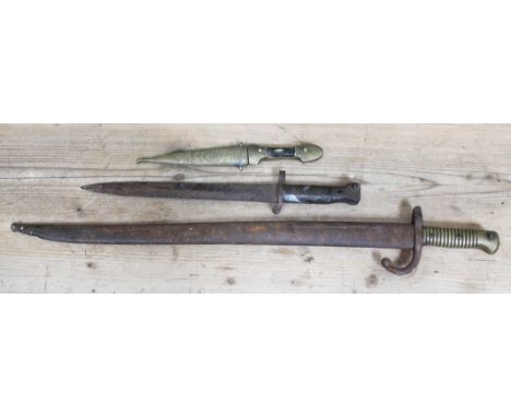 Assorted swords comprising a French bayonet, another and an eastern dagger.  