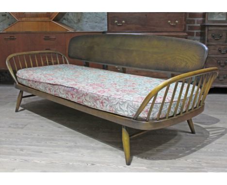 An Ercol day bed. Condition - good, general wear only. (The upholstery on the chairsmay not comply with the Furniture and Fur