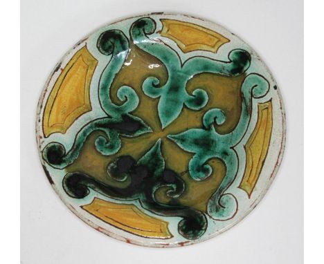 A Della Robbia scaffitio dish No.25, dated 1901 and monogrammed 'G.H.F', diam. 16cm.  Condition - mino nibbles and wear to gl