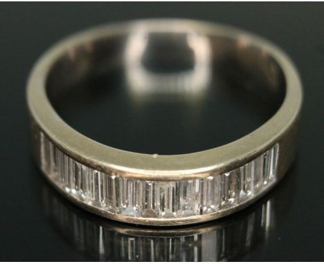 A half hoop diamond eternity ring, set with fifteen baguette cut diamonds, total approx. diamond weight 1.2 carats, band unma
