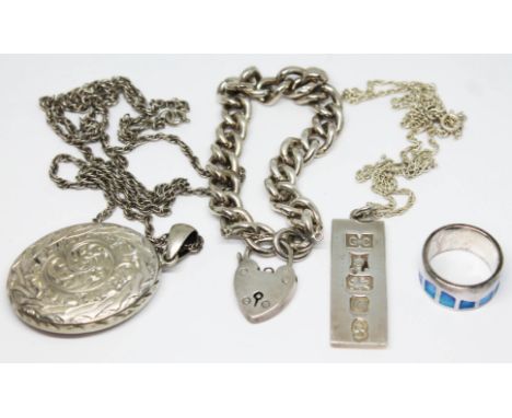 Assorted silver jewellery comprising a bracelet, an ingot on chain, a locket on chain and an enamelled ring, gross weight 93.