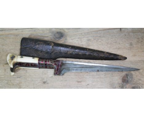 A North African Jambiya dagger, 6 1/2" blade with patterned sheath  