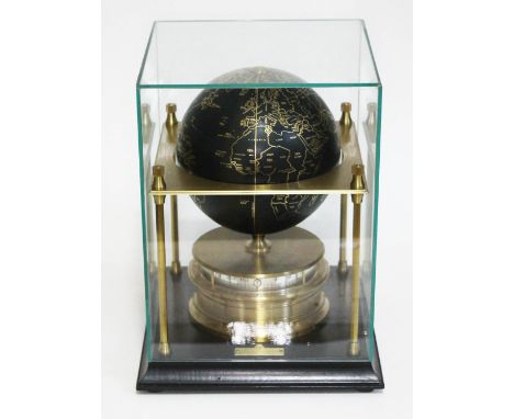 A Royal Geographical Society World Clock under glass dome, height 28.5cm.  
