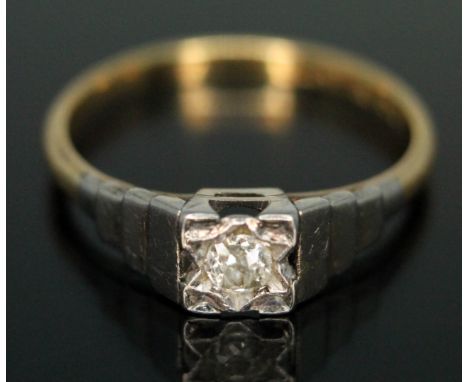An Art Deco diamond solitaire ring, the old European cut diamond weighing approx. 0.10 carats, stepped white metal shoulders,